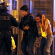 French special forces evacuate people, as people gather near the Bataclan concert hall in Paris.